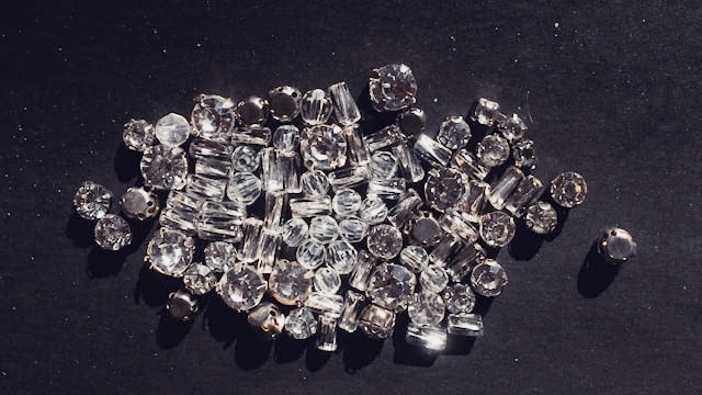 Not all burs contain natural diamonds.  Many contain synthetic diamonds (Lab grown).